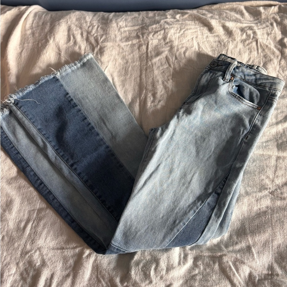 Almost Famous Flare Leg Jeans Size 3 
Multi colored denim. Frayed bottoms.